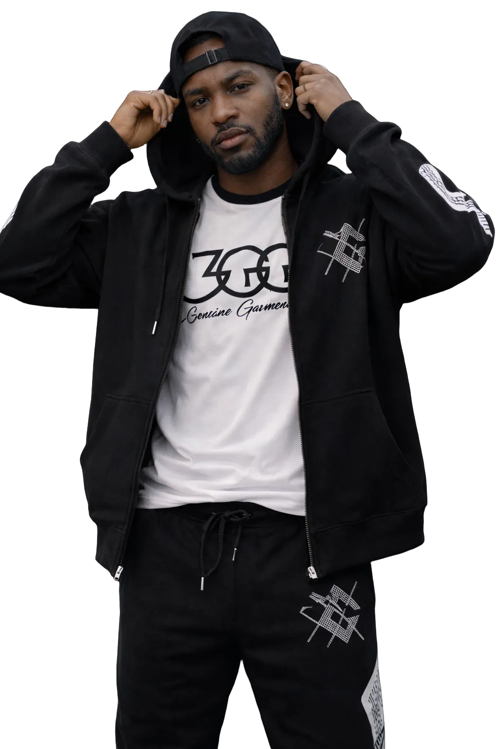 Person wearing a black tracksuit with black graphics on a white background
